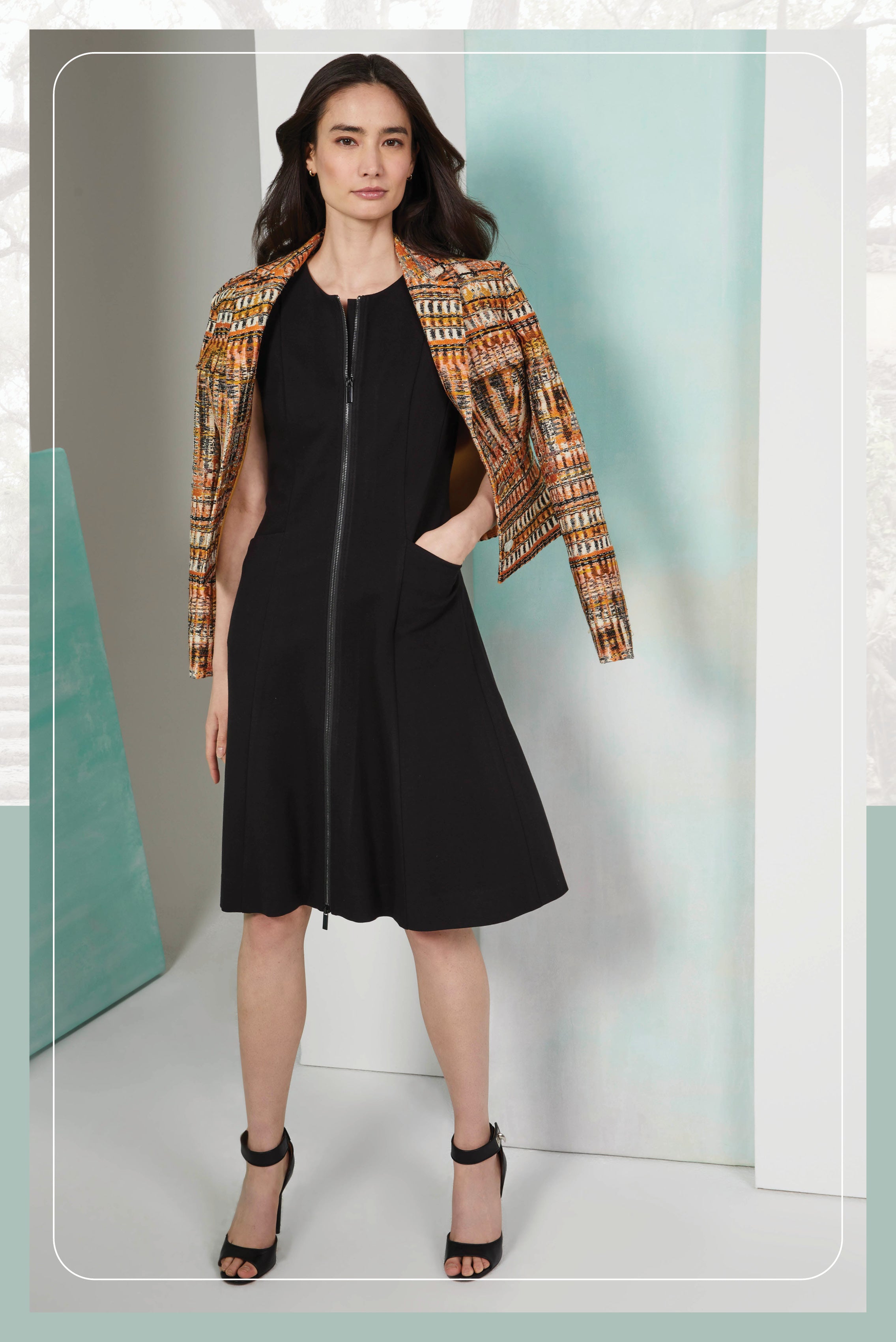 Photo of a model wearing the Carbonado dress, a Italian ponte knit dress. Also the Letizia jacket, metallic French jacquard jacket.