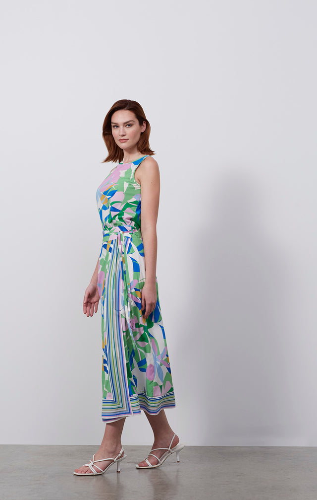 Ecomm photo of a model wearing the Veranda skirt, which is a flower & stripe print stretch silk crêpe de chine skirt.