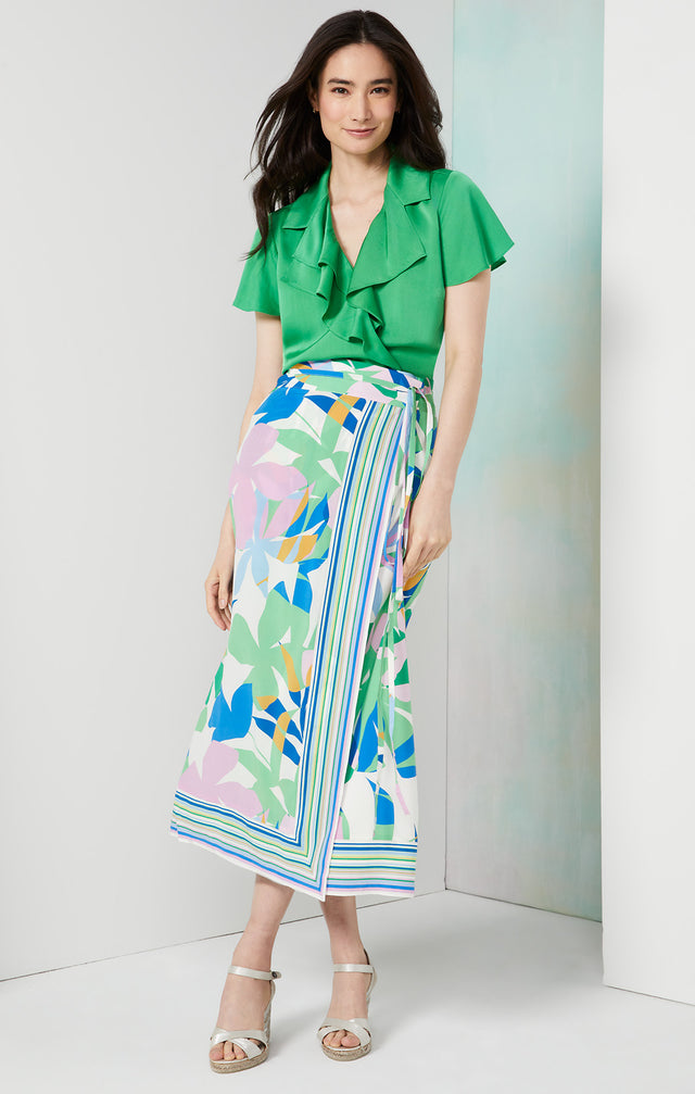 Lookbook photo of a model wearing the Veranda skirt, which is a flower & stripe print stretch silk crêpe de chine skirt.