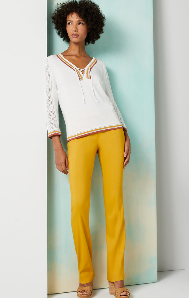 Lookbook photo of a model wearing the El Dorado pants, which is a belted Italian stretch linen pants.
