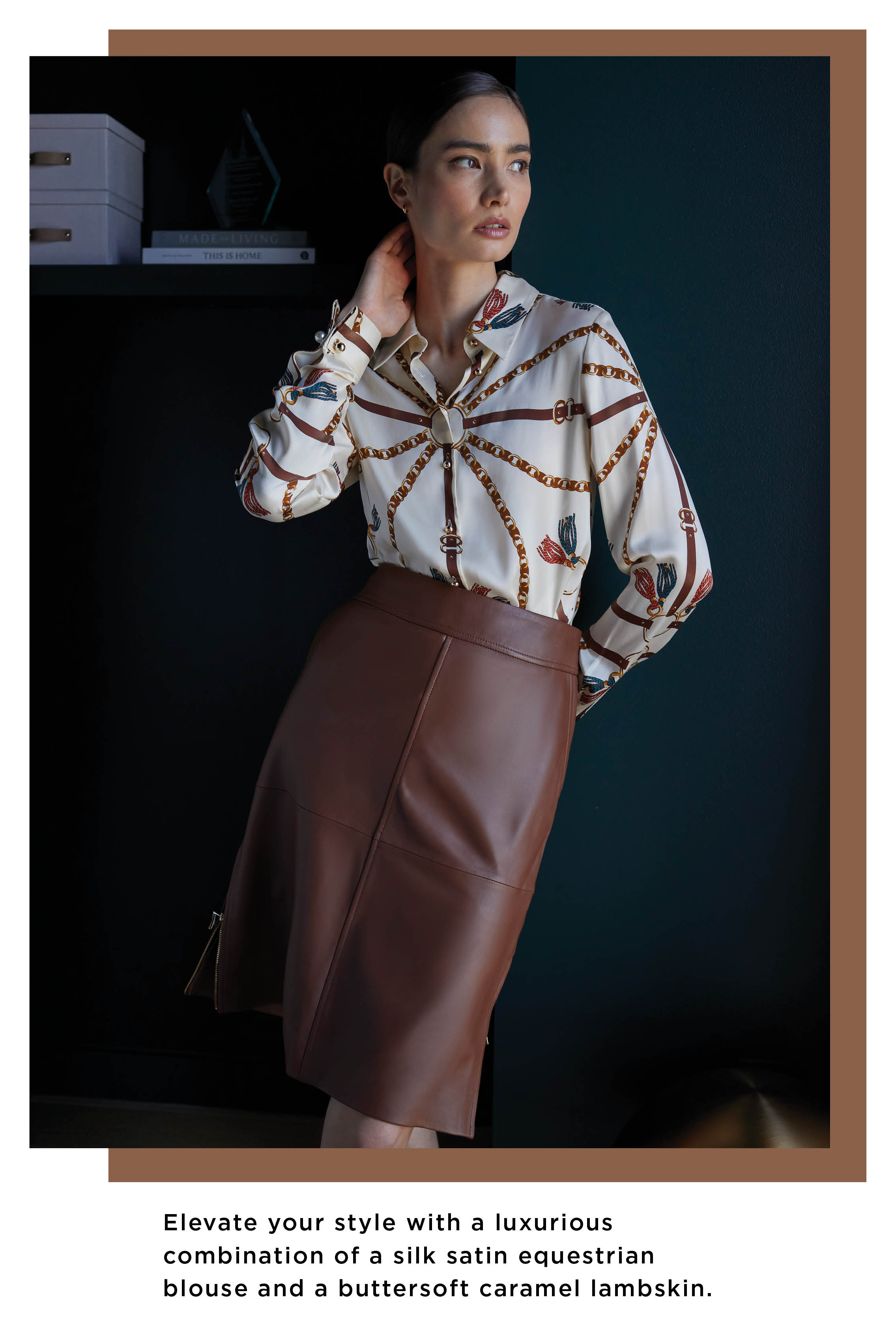 Experience a fusion of elegance and equestrian charm with a captivating silk satin blouse in a stunning livery print. The deep caramel lambskin A-line skirt beautifully complements the blouse, offering a touch of sophistication and timeless style.