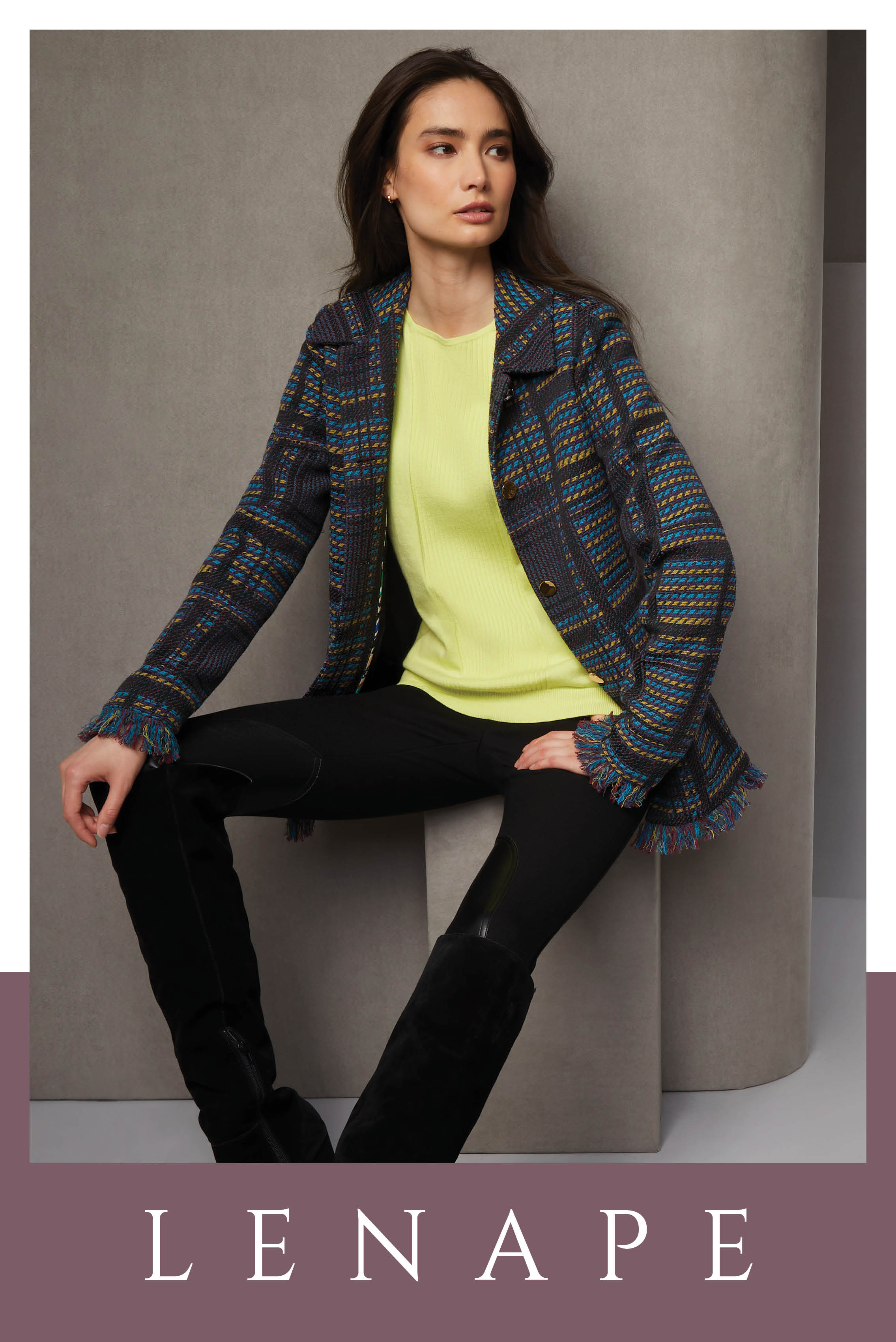 This sporty riding outfit is a nod to the Lenape people who named Manhattan. The woven plaid jacquard jacket has self fringe and a pioneer spirit. The black twill riding pants have European leather knee patches.