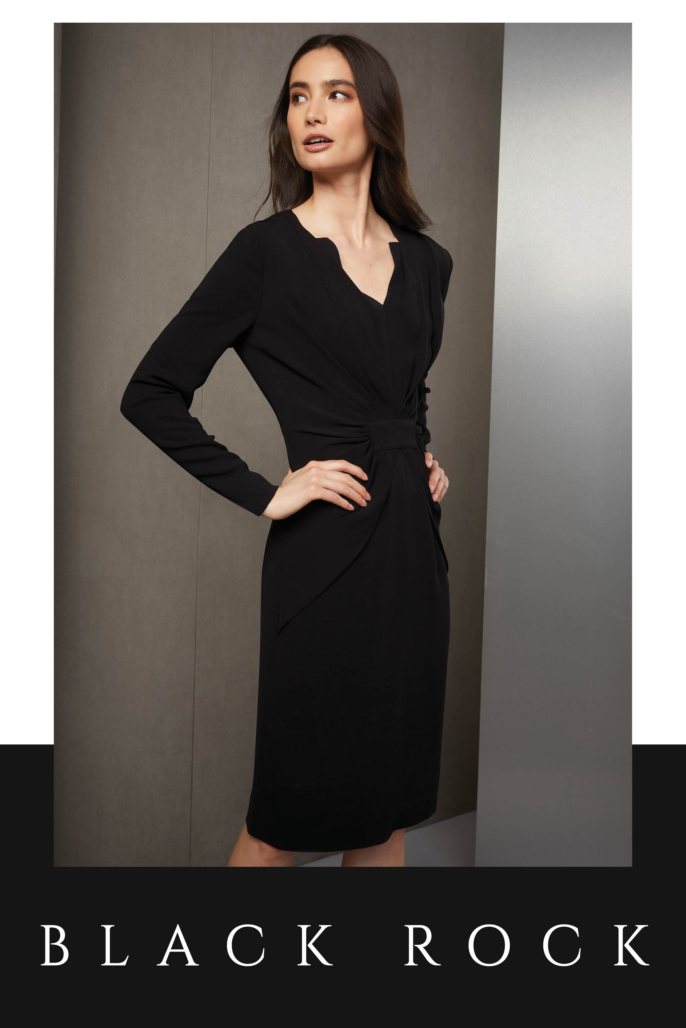 This black stretch crêpe sheath dress is an instant icon. It is layered with an arresting double V-neck. Plus, the front gathers in a sunburst pattern add volume for a comfortable fit.