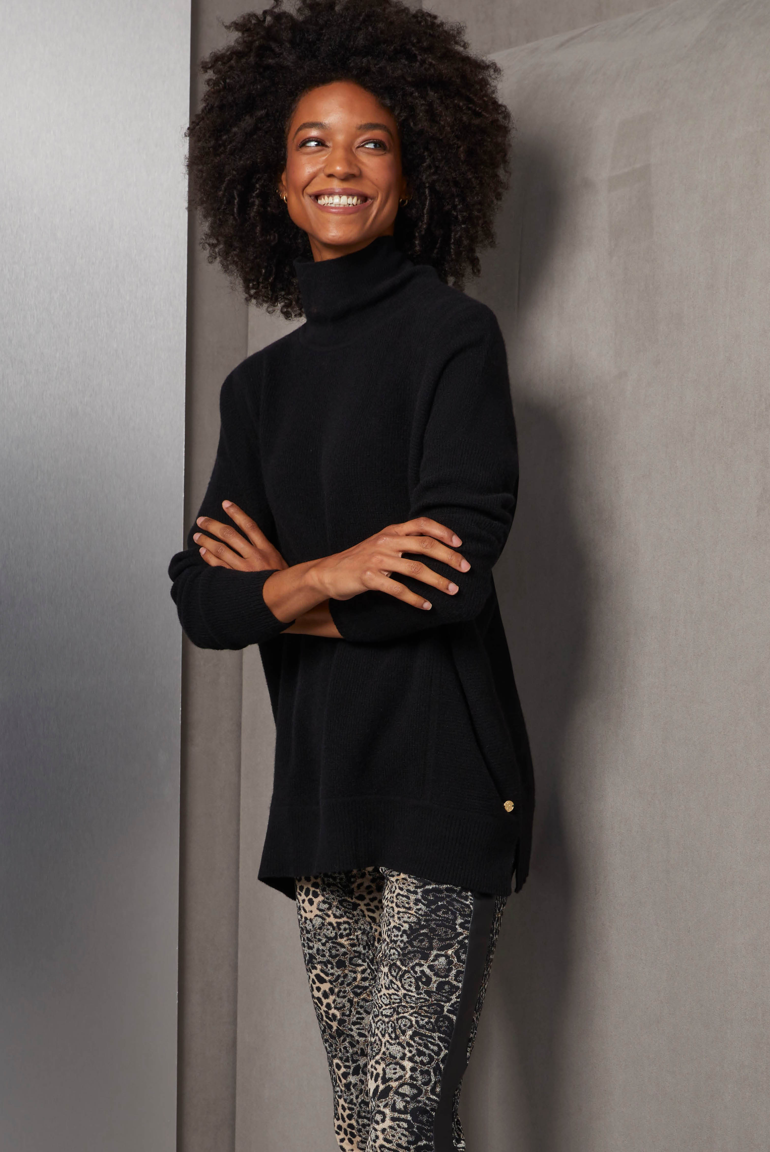 Cultivate your downtown aura with this oversized cashmere turtleneck in black, textured with multi-directional rib stitches. The wow factor of its volume and luxury hand feel is complemented by the slim Italian jacquard ankle pants.