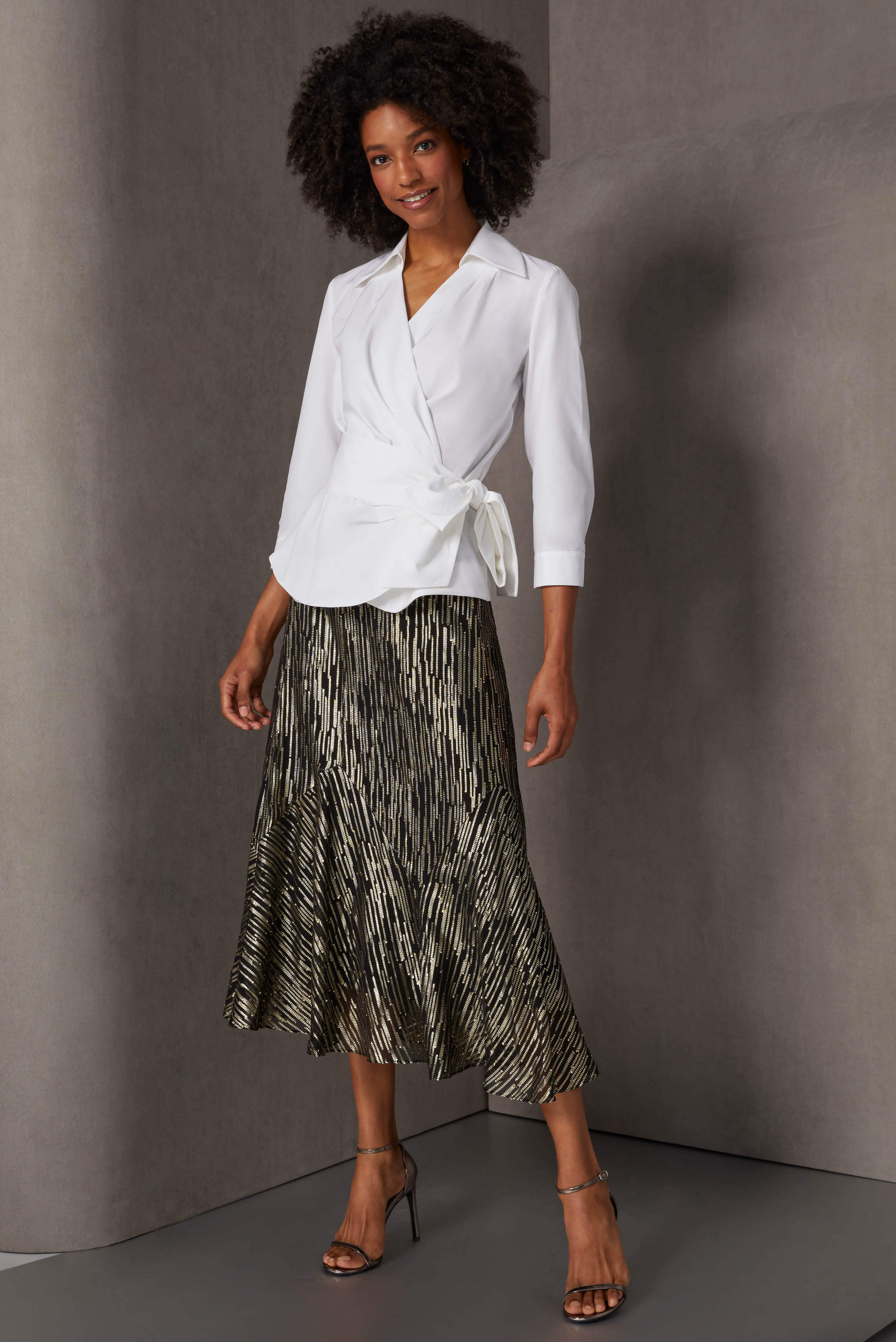 This latest version of the iconic Bettina white blouse is silk-enriched poplin with a wrap bodice, dramatic collar, and epic 90” self sash for an exciting front bow.