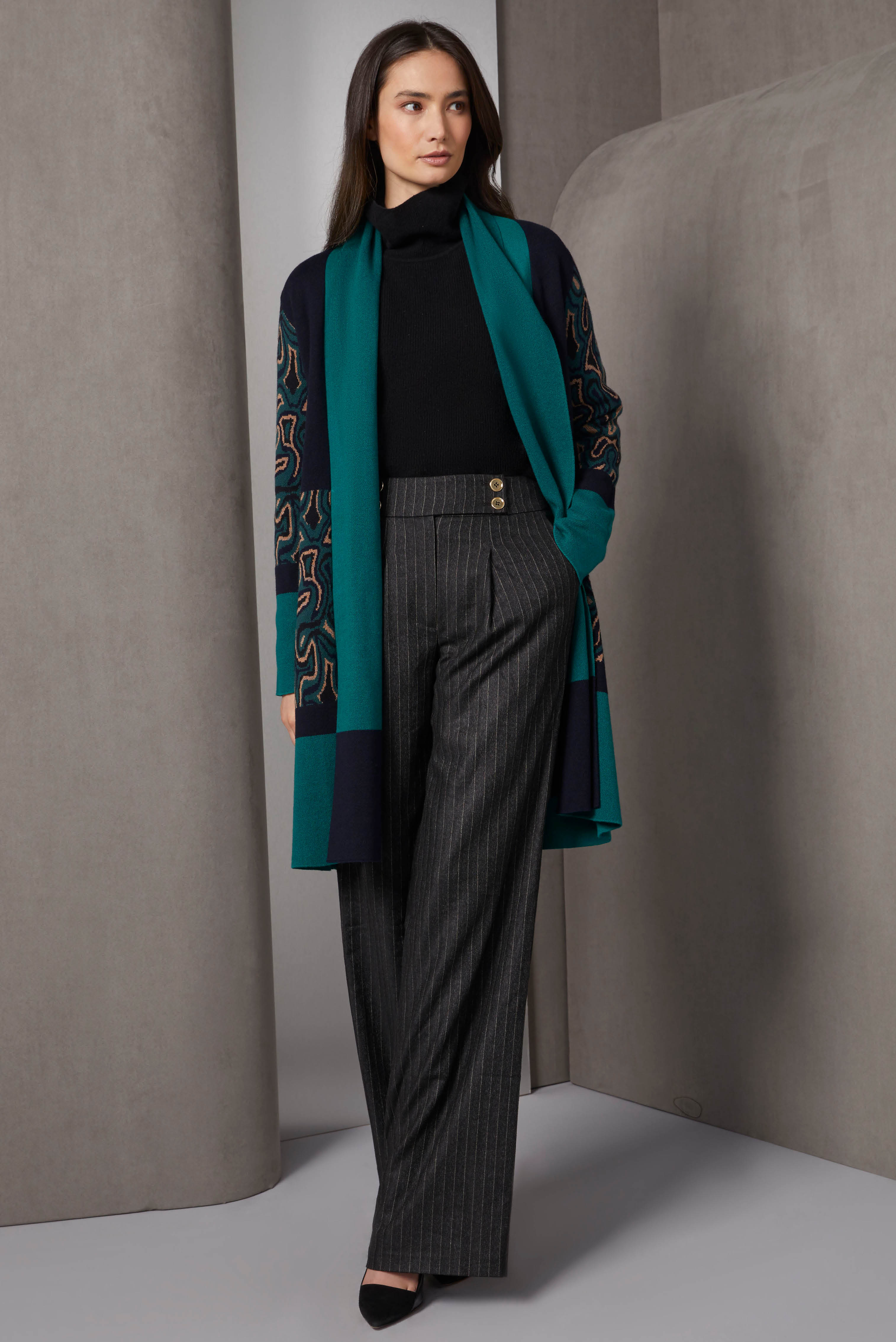A cashmere-softened statement cardigan, ideal for special-occasions, combines solid green and black colorblock panels with panels in a complex, floral-look birdseye jacquard.