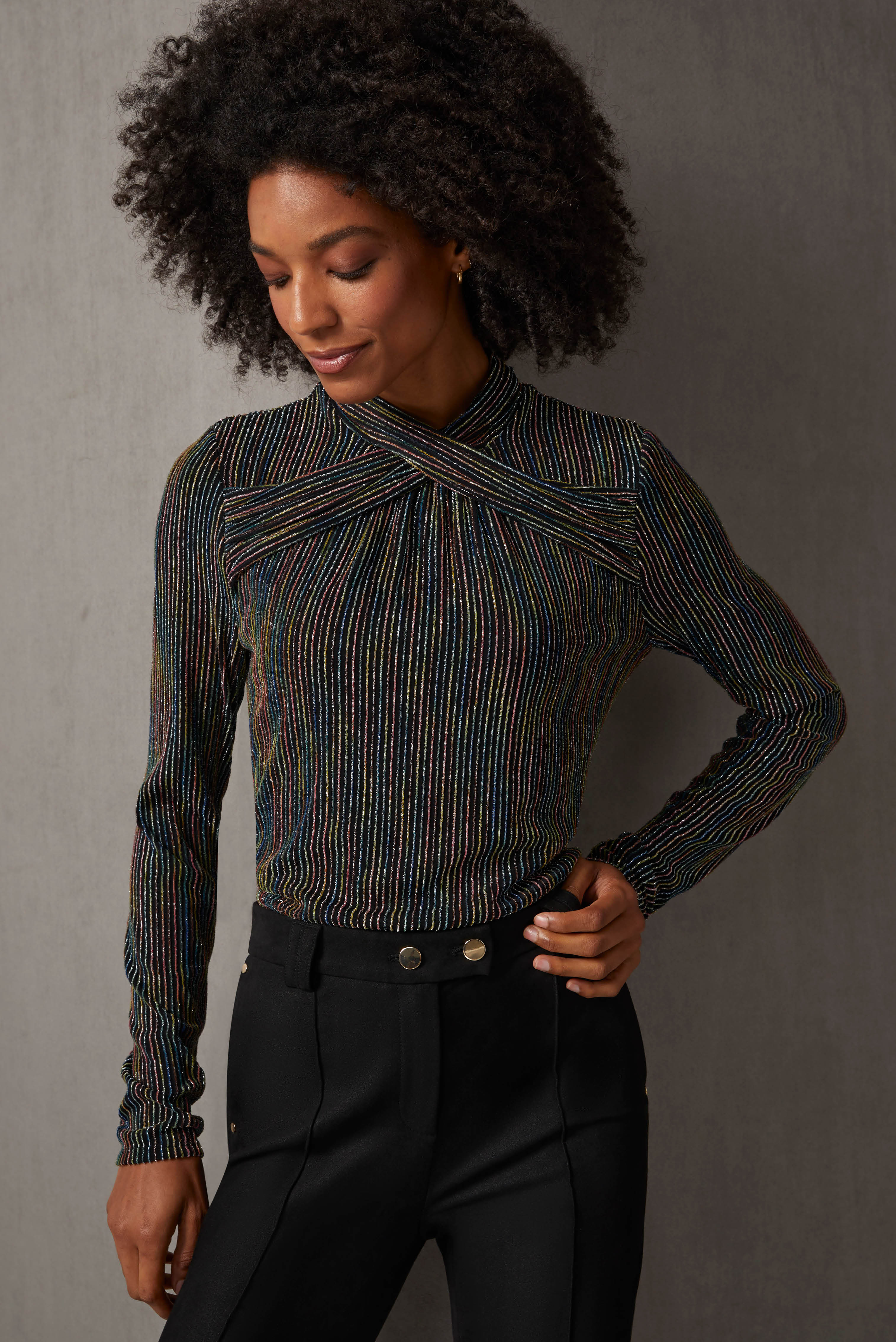 This special-occasion tee is black jersey with sparkling metallic ribs in five pop colors. Front gathers and a crisscross neck enhance the lavish texture.