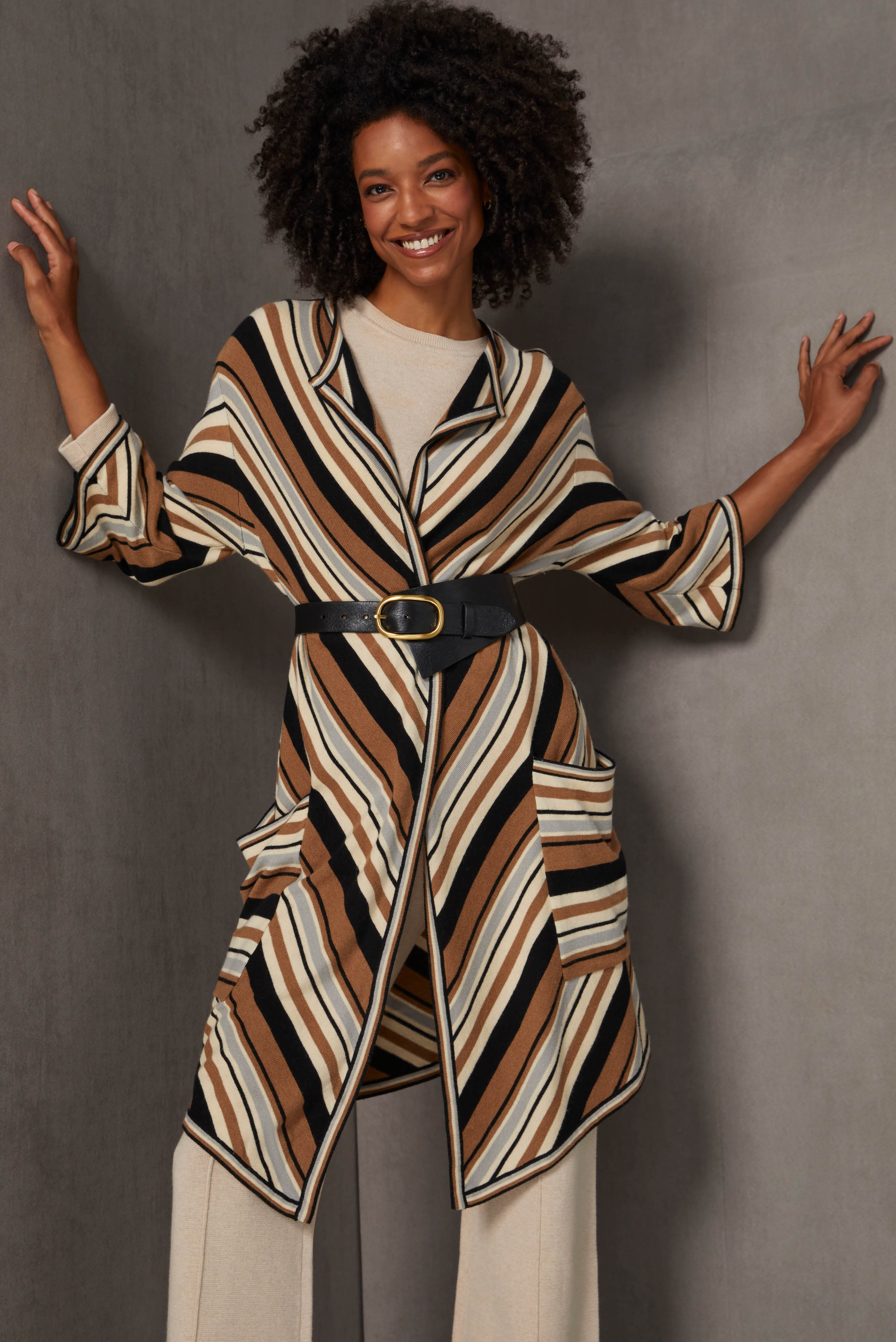 Cashmere-softened luxury knit layers add up to classic elegance. The solid tapioca jersey knit 3/4 sleeve pullover and front-slit, pintucked ankle pull-ons are enriched with rows of zig-zag ribs at the cuffs and waistband.