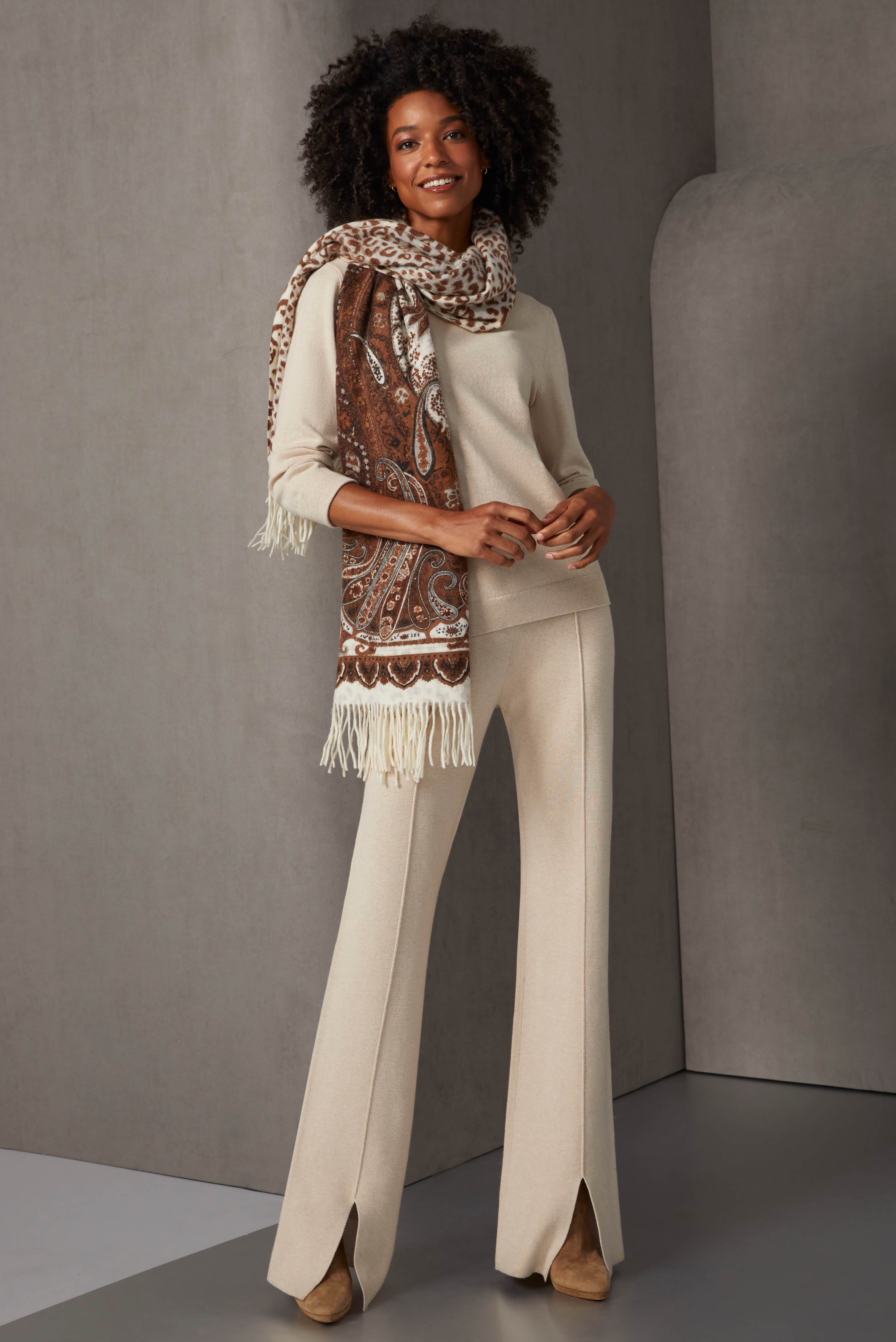 Brighten the winter mood with deluxe knits in creamy tapioca. The 3/4 sleeve jersey knit pullover and pull-on ankle pants are accented with subtle zig-zag ribs at the cuffs and waistband.