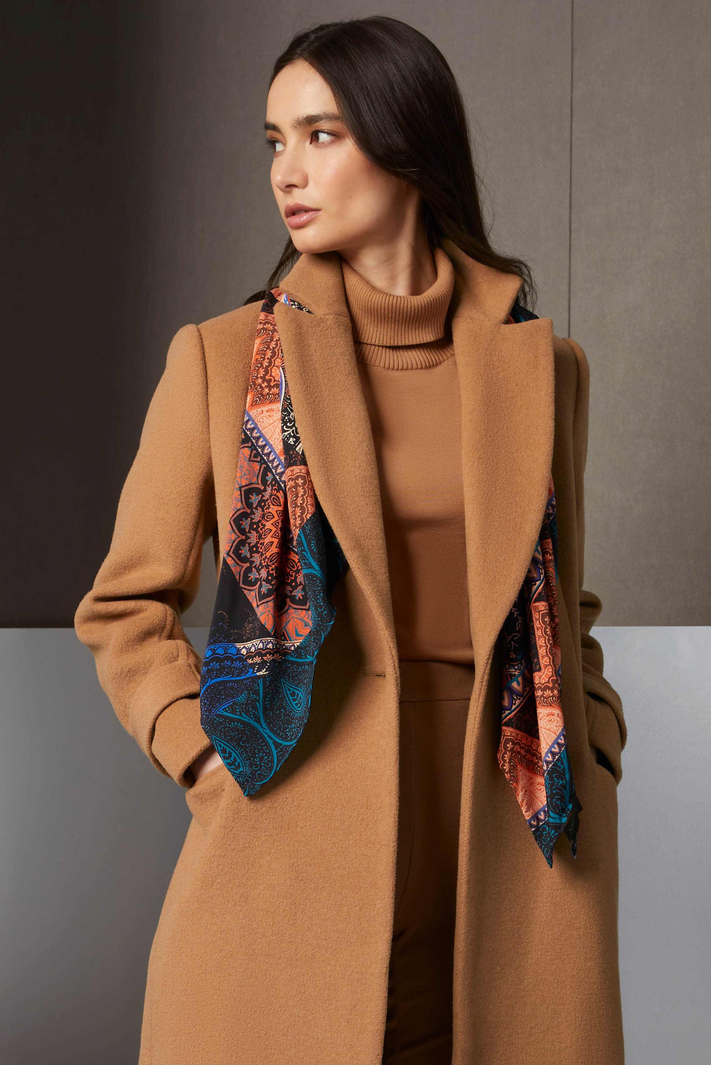 An attractive camel shade stars in a well-coordinated ensemble. Start with a wool-blend coat that offers fine tailoring and warmth. Layer it over a turtleneck in precious Suvin cotton for soft luxury.