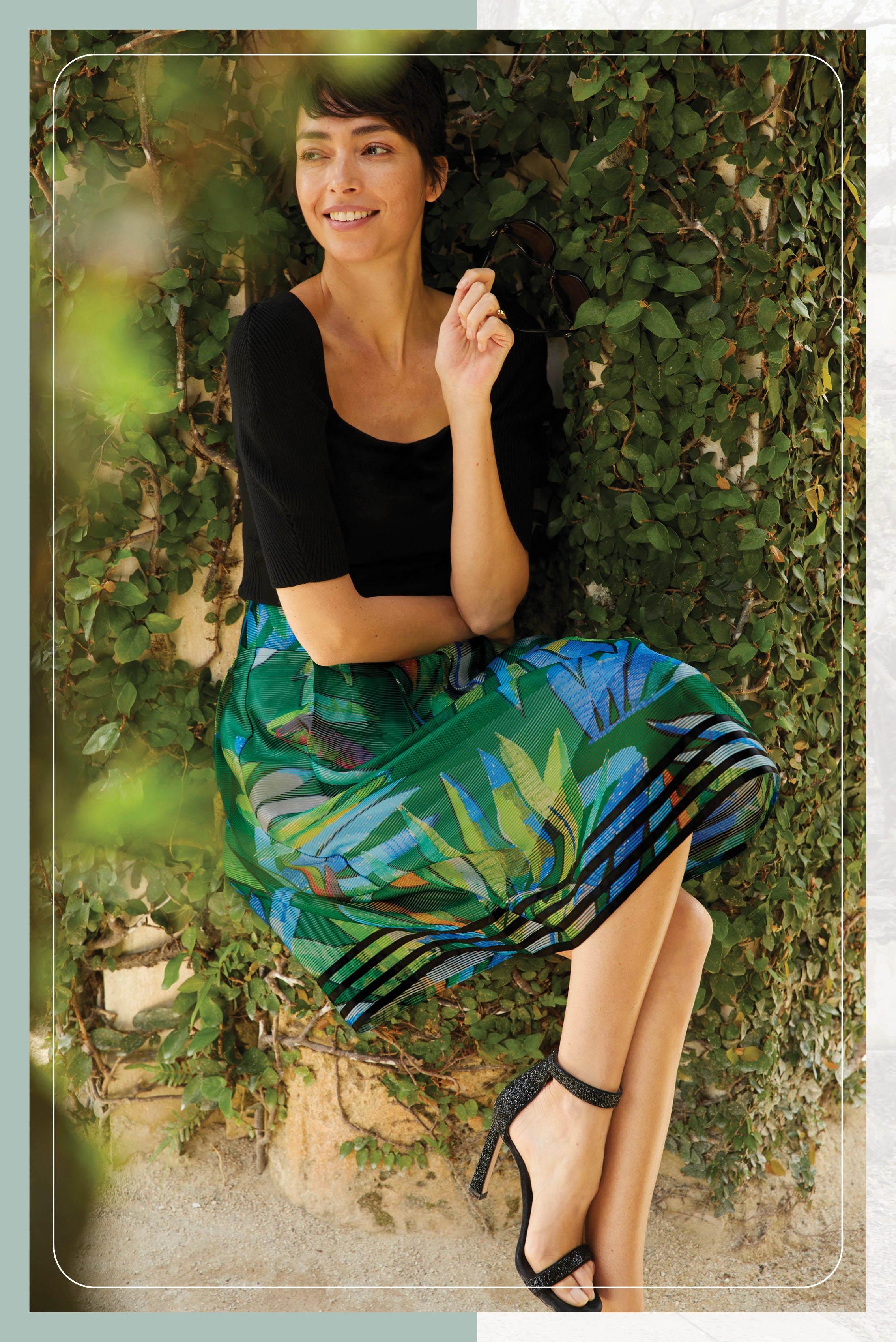 Photo of a model wearing the Tropical skirt, which is a which is a print skirt in striped Italian organza jacquard.