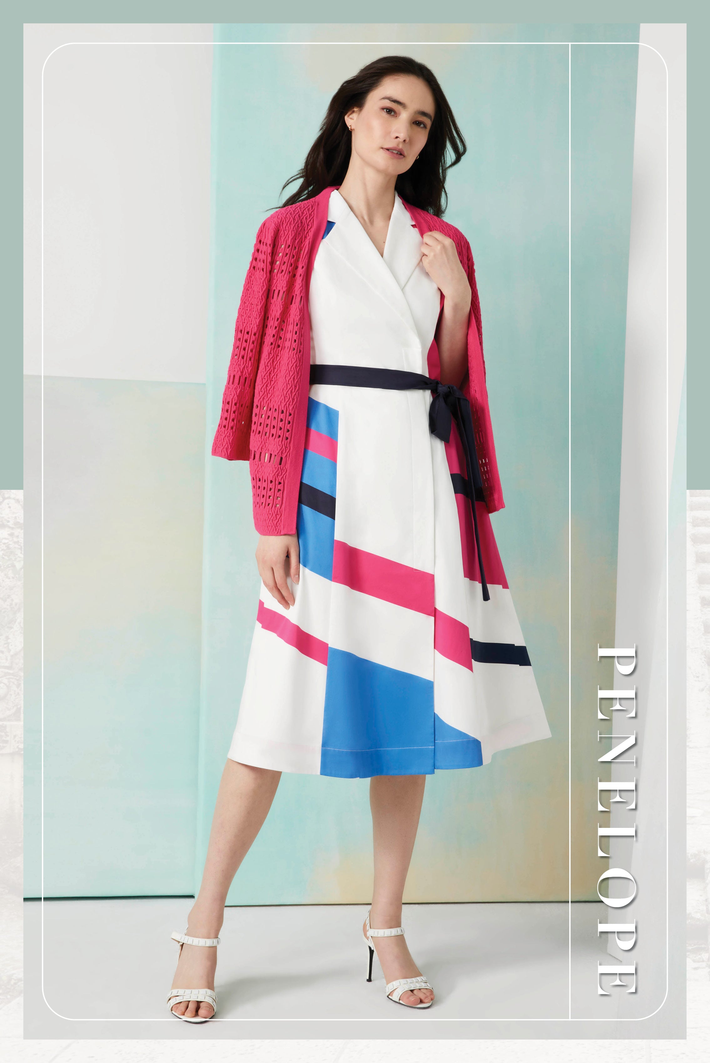 Photo of a model wearing the Penelope dress, a portrait wrap dress in stretch cotton sateen.