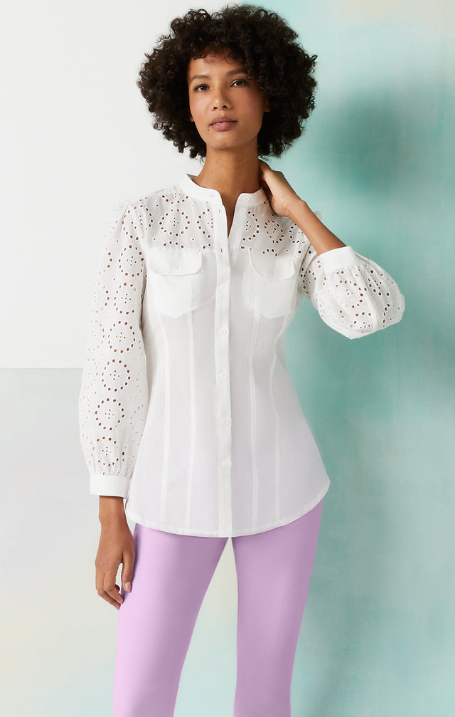 Lookbook photo of a model wearing the Tabernas-Wht shirt, which is a white eyelet embroidery blouse.