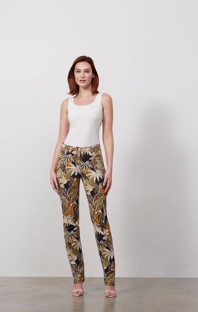 Ecomm photo of a model wearing the Inspiration pants, which is a tropical print jeans.
