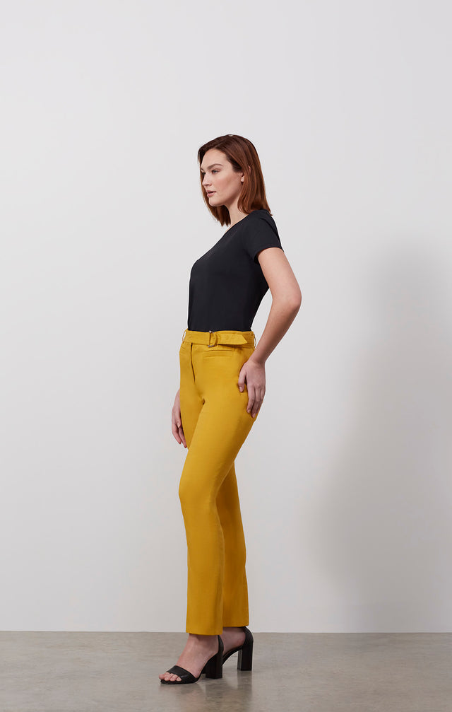 Ecomm photo of a model wearing the El Dorado pants, which is a belted Italian stretch linen pants.