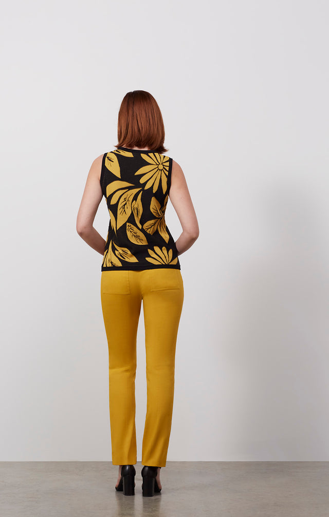 Ecomm photo of a model wearing the Golden-Shell, which is a floral intarsia knit shell.