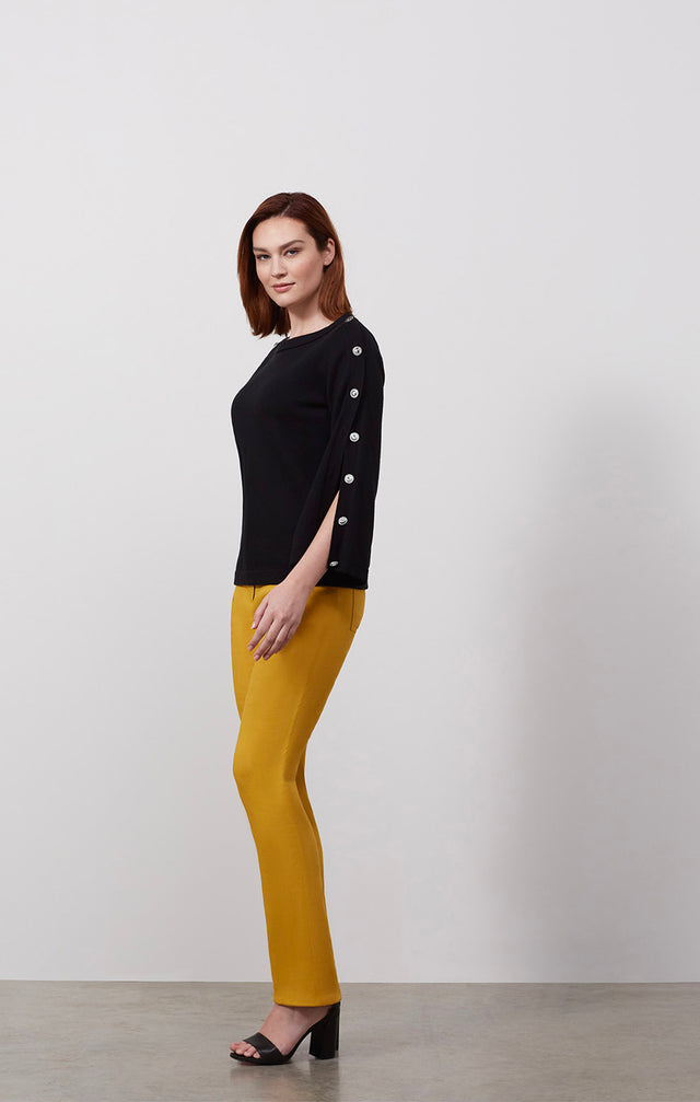 Ecomm photo of a model wearing the Caravel sweater, which is a silk-softened sailor-sleeve knit top.