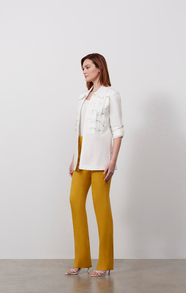 Ecomm photo of a model wearing the Palisade shirt, which is a white stretch sateen blouse.