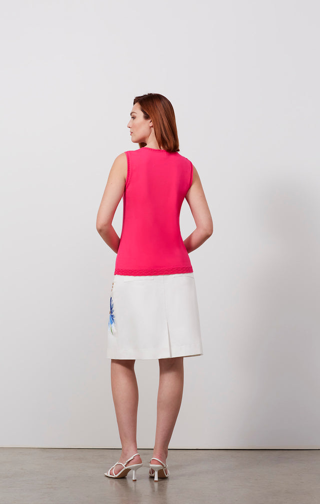 Ecomm photo of a model wearing the Blushing-Shell, which is a airy ottoman and pointelle knit shell.