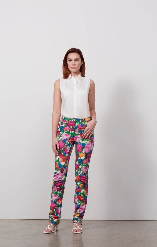 Ecomm photo of a model wearing the Flamenco pants, which is a floral-print jeans in stretch cotton twill .