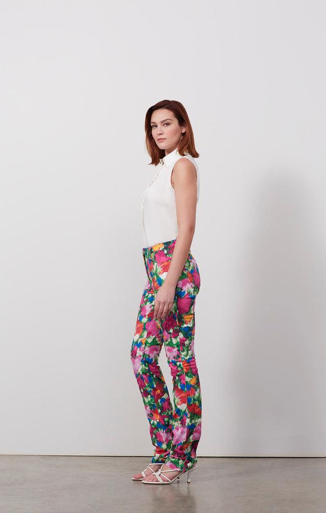 Ecomm photo of a model wearing the Flamenco pants, which is a floral-print jeans in stretch cotton twill .