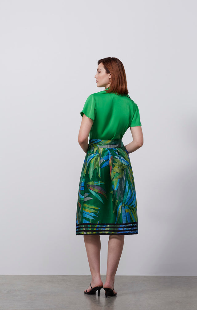 Ecomm photo of a model wearing the Tropical skirt, which is a print skirt in striped Italian organza jacquard.