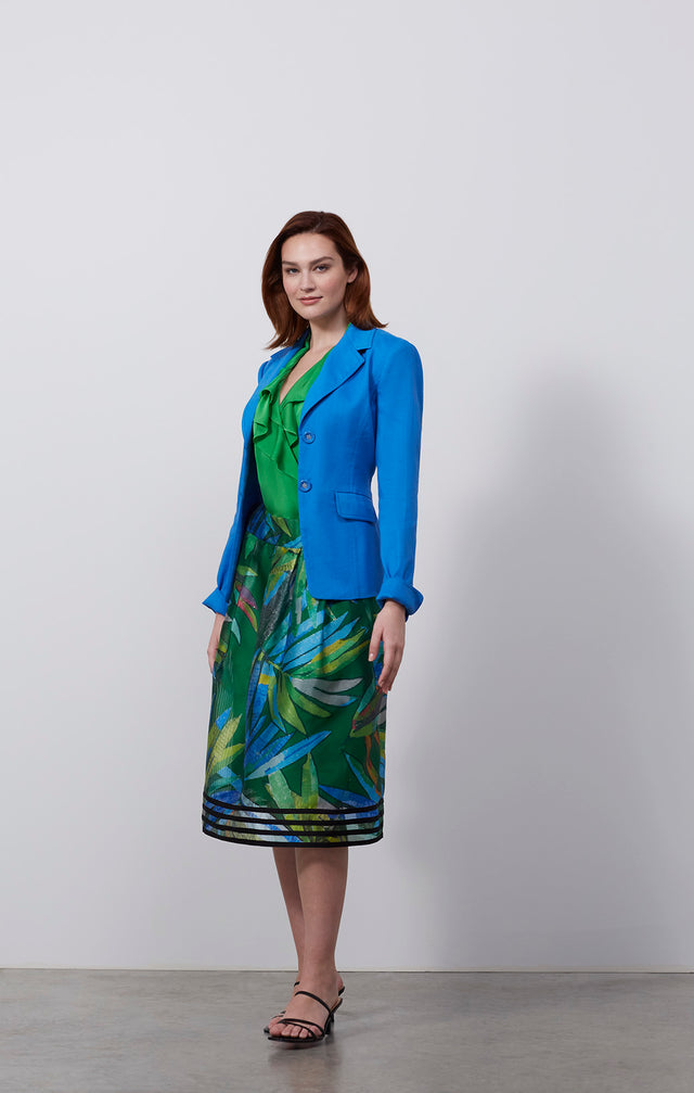 Ecomm photo of a model wearing the Tanager skirt, which is an Italian stretch linen twill jacket.