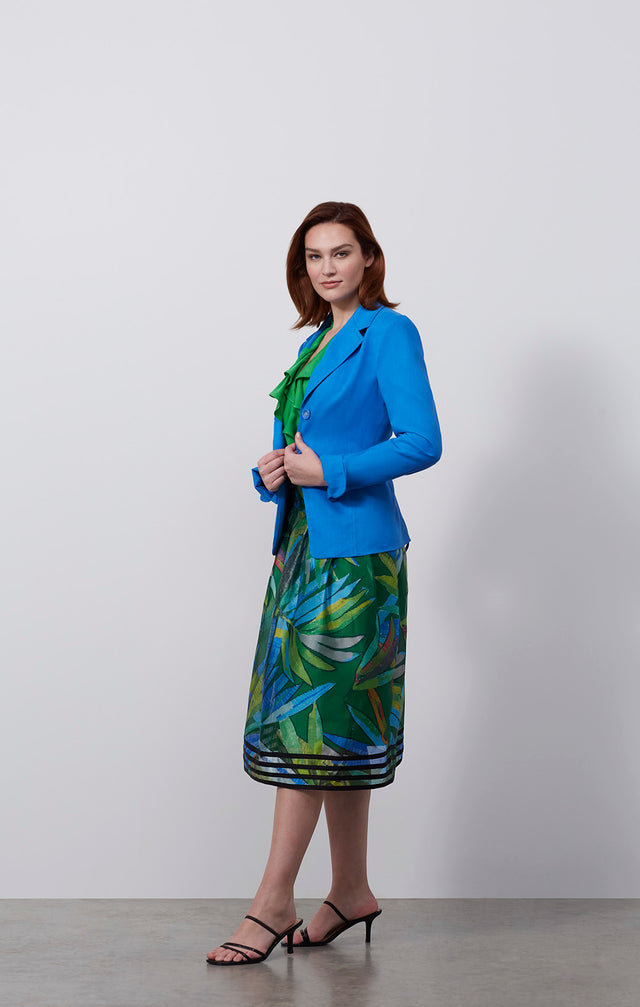 Ecomm photo of a model wearing the Tanager skirt, which is an Italian stretch linen twill jacket.