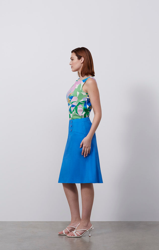 Ecomm photo of a model wearing the Tanager skirt, which is an Italian stretch linen twill skirt.