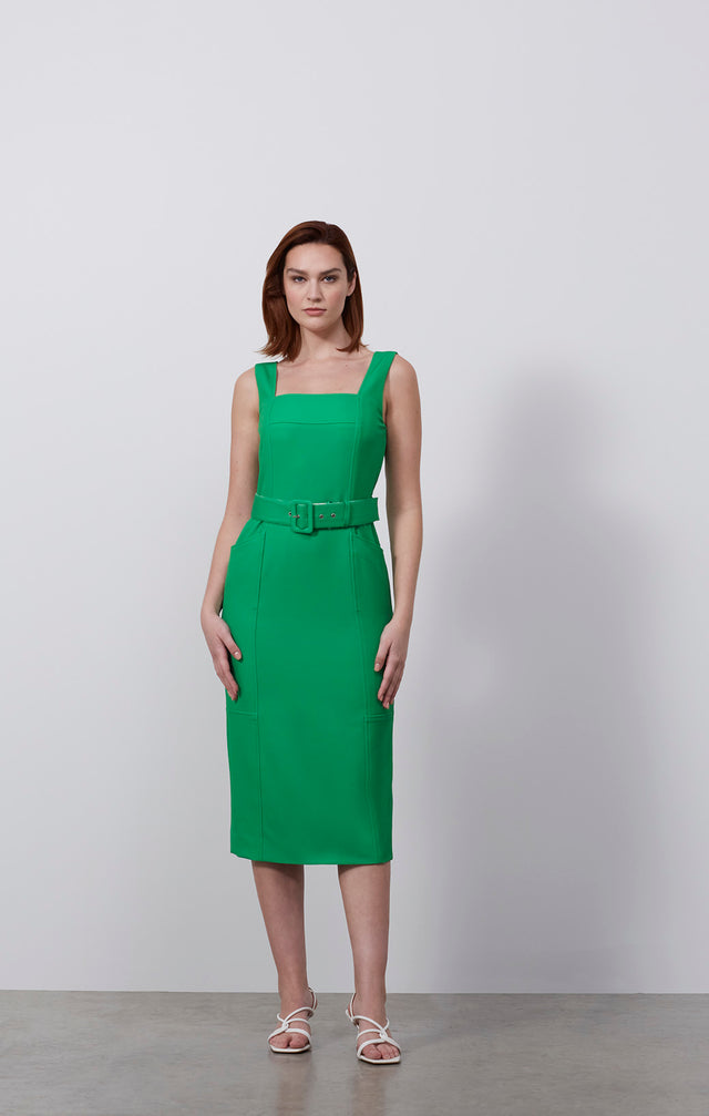 Ecomm photo of a model wearing the Esmeralda dress, which is a belted dress in stretch double weave.