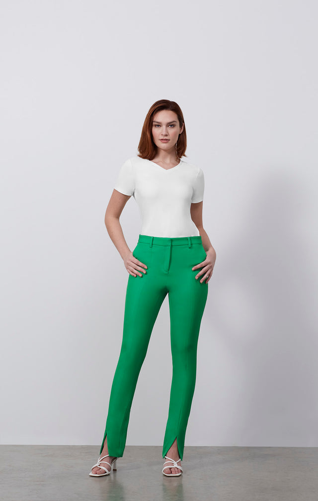 Ecomm photo of a model wearing the Swift-Grn pants, which is a fluid double-weave pants.