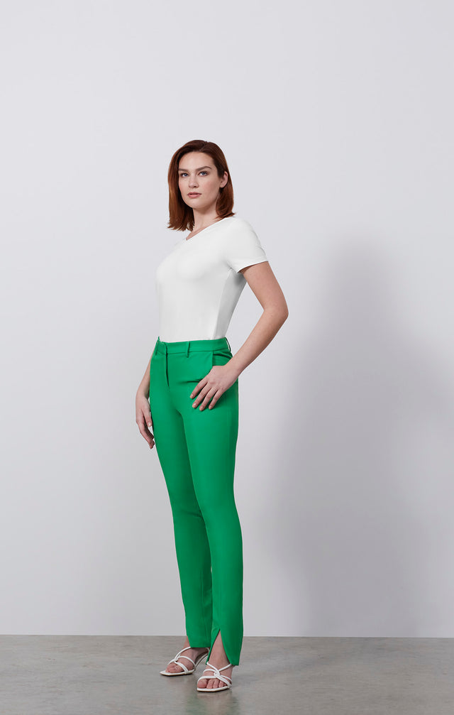 Ecomm photo of a model wearing the Swift-Grn pants, which is a fluid double-weave pants.