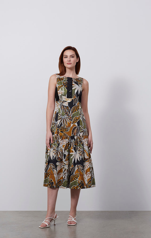 Ecomm photo of a model wearing the Picasso dress, which is a silk-rich tropical print dress.