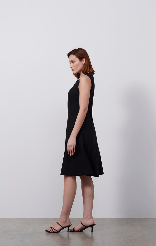 Ecomm photo of a model wearing the Carbonado dress, which is an Italian ponte knit dress.