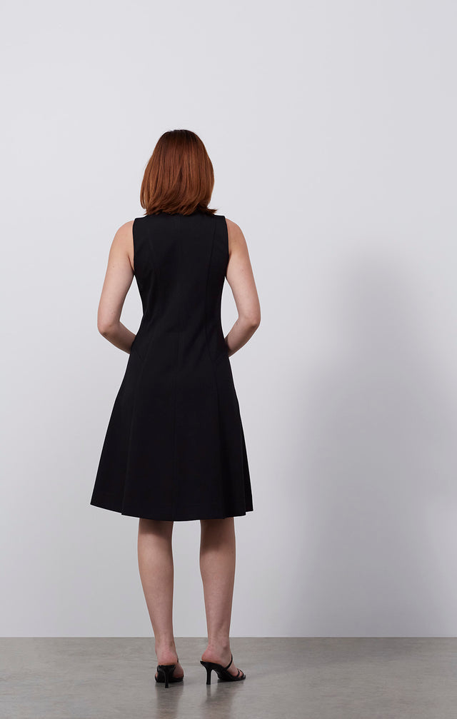 Ecomm photo of a model wearing the Carbonado dress, which is an Italian ponte knit dress.