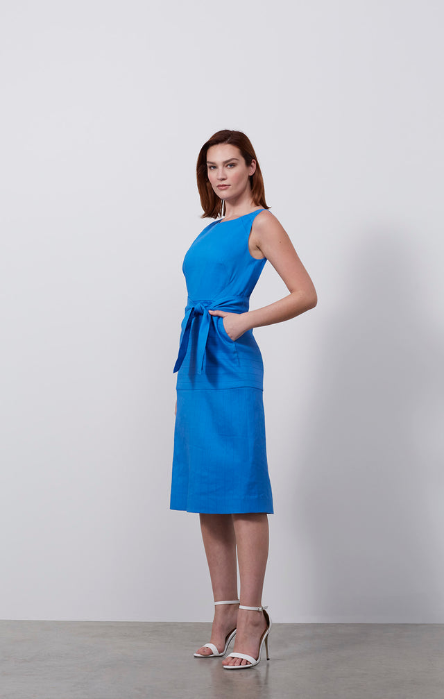 Ecomm photo of a model wearing the Tanager dress, which is an Italian stretch linen twill dress.