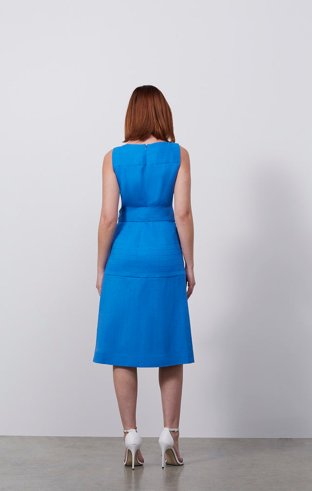 Ecomm photo of a model wearing the Tanager dress, which is an Italian stretch linen twill dress.
