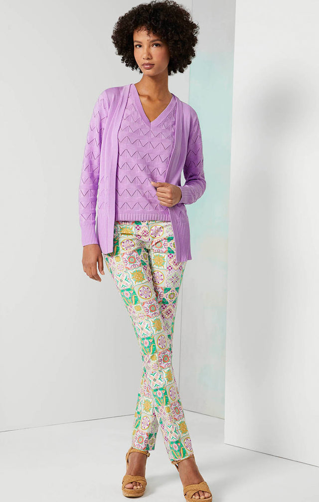 Lookbook photo of a model wearing the Alcazar pants, which is a Tile-Printed Sateen Jeans.