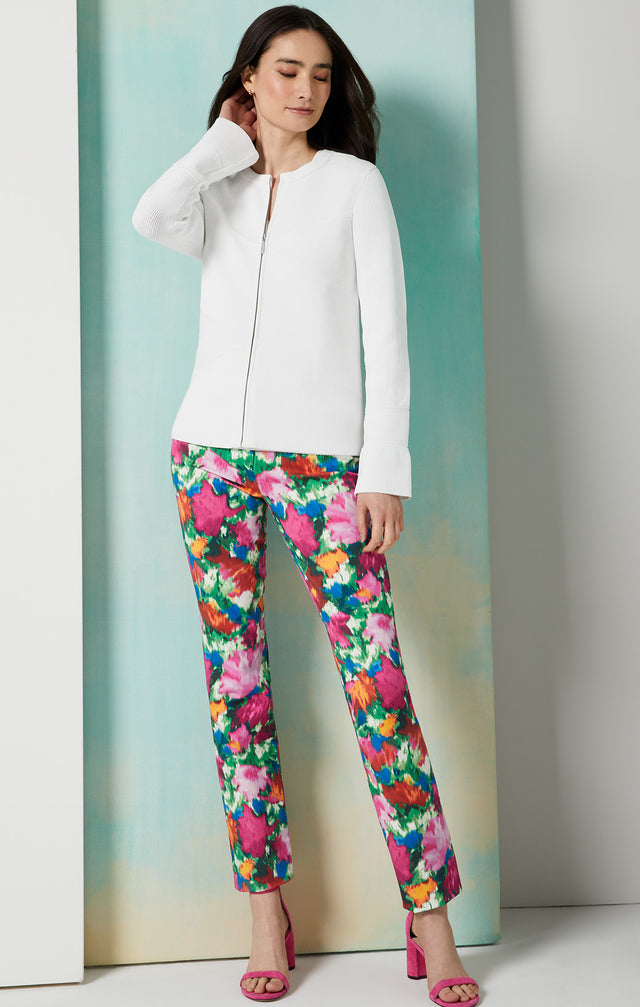 Lookbook photo of a model wearing the Flamenco pants, which is a floral-print jeans in stretch cotton twill .