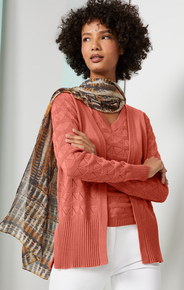 Lookbook photo of a model wearing the Turron-Cardi, which is a silk-enriched cardigan.