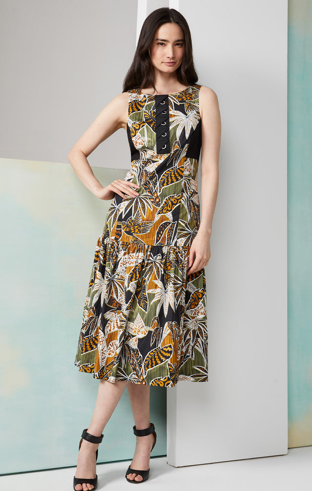 Lookbook photo of a model wearing the Picasso dress, which is a silk-rich tropical print dress.