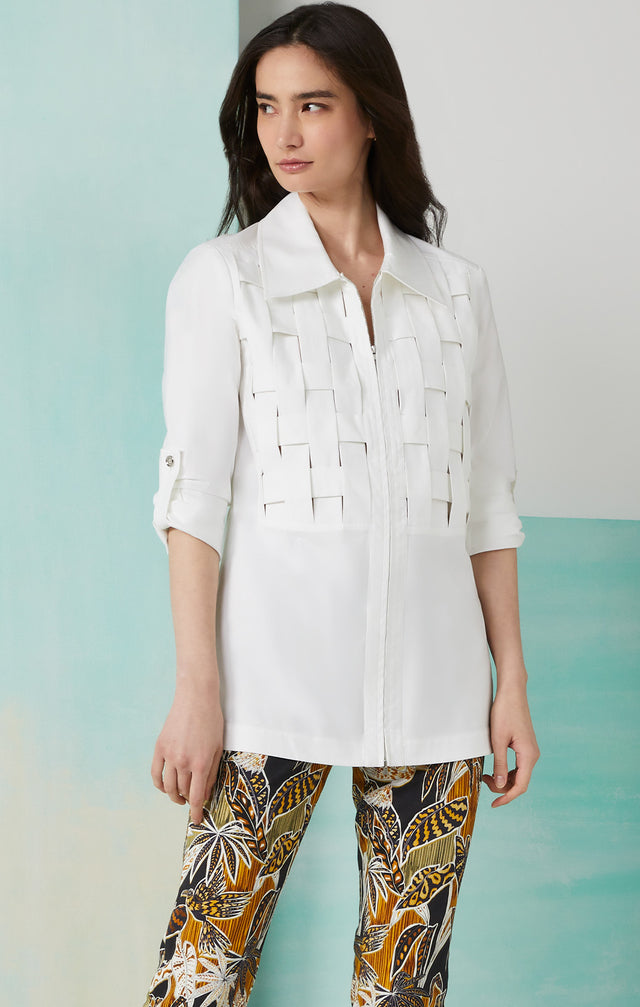 Lookbook photo of a model wearing the Palisade shirt, which is a white stretch sateen blouse.