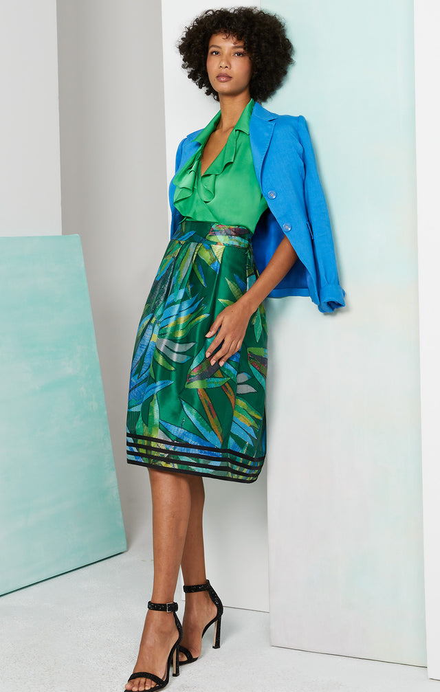 Lookbook photo of a model wearing the Tropical skirt, which is a print skirt in striped Italian organza jacquard.