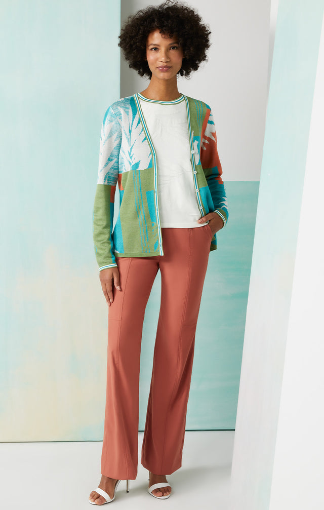 Lookbook photo of a model wearing the Painted Fern sweater, which is a leaf-textured knit shell with colorful tipping.
